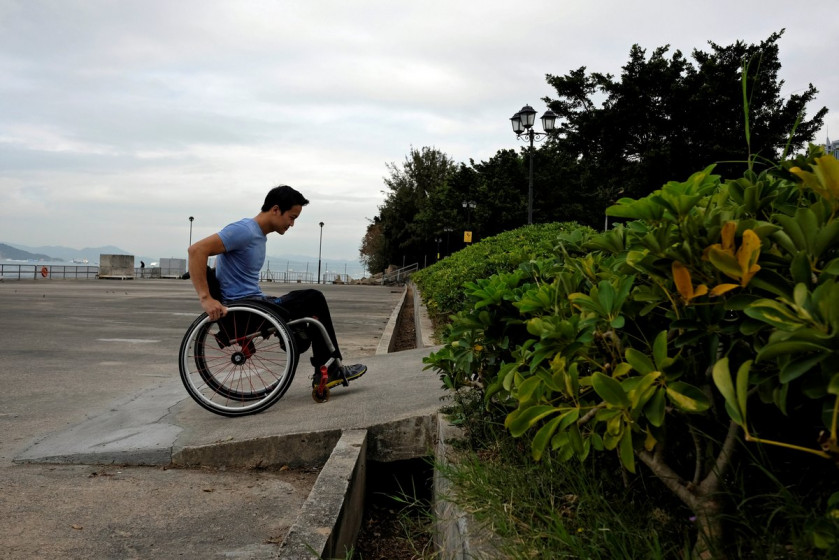 Wheelchairbound athlete honoured for climbing up mountain, Asia News