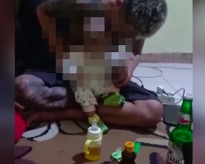 What&#039;s in the milk bottle? Man in Indonesia caught feeding baby beer and energy drink