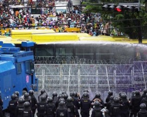Thai police fire water cannon at Parliament protesters
