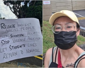 Woman allegedly protests outside Chinese embassy with sign calling for release of &#039;innocent arrested people&#039; and &#039;only scientific isolation&#039;