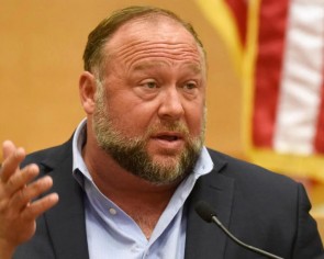 Conspiracy theorist Alex Jones lashes out at critics at trial over Sandy Hook hoax claims