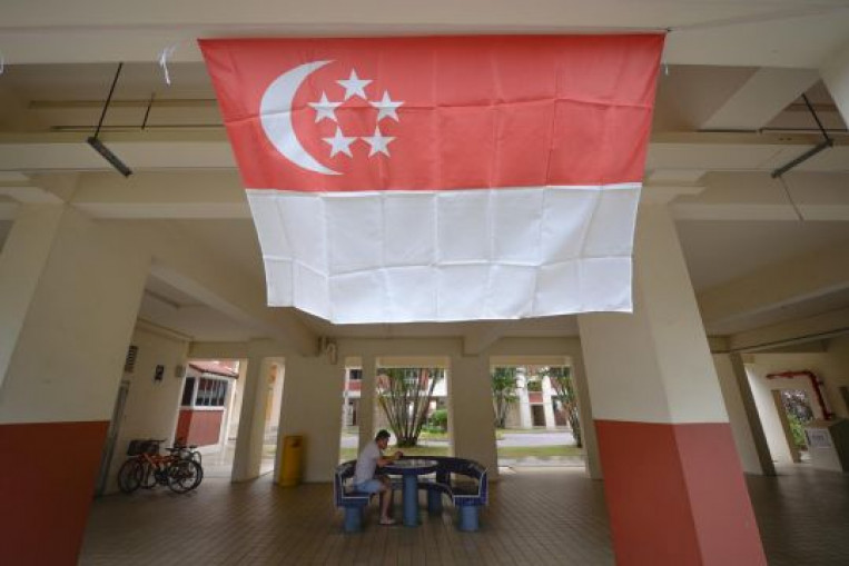 Man charged with burning Singapore flag, which caused damage to seven others, Singapore News ...
