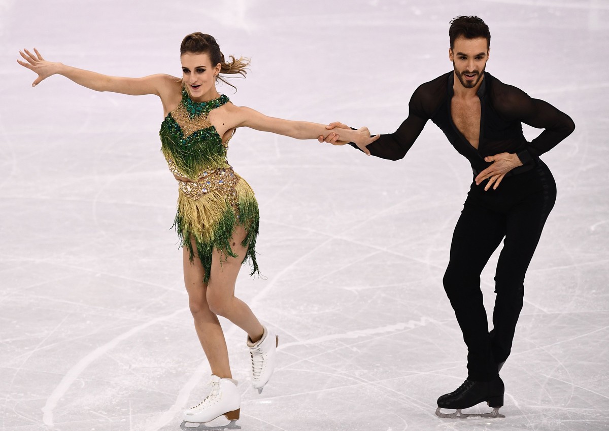 Olympics: With glue and tape, figure skaters strive to keep covered up