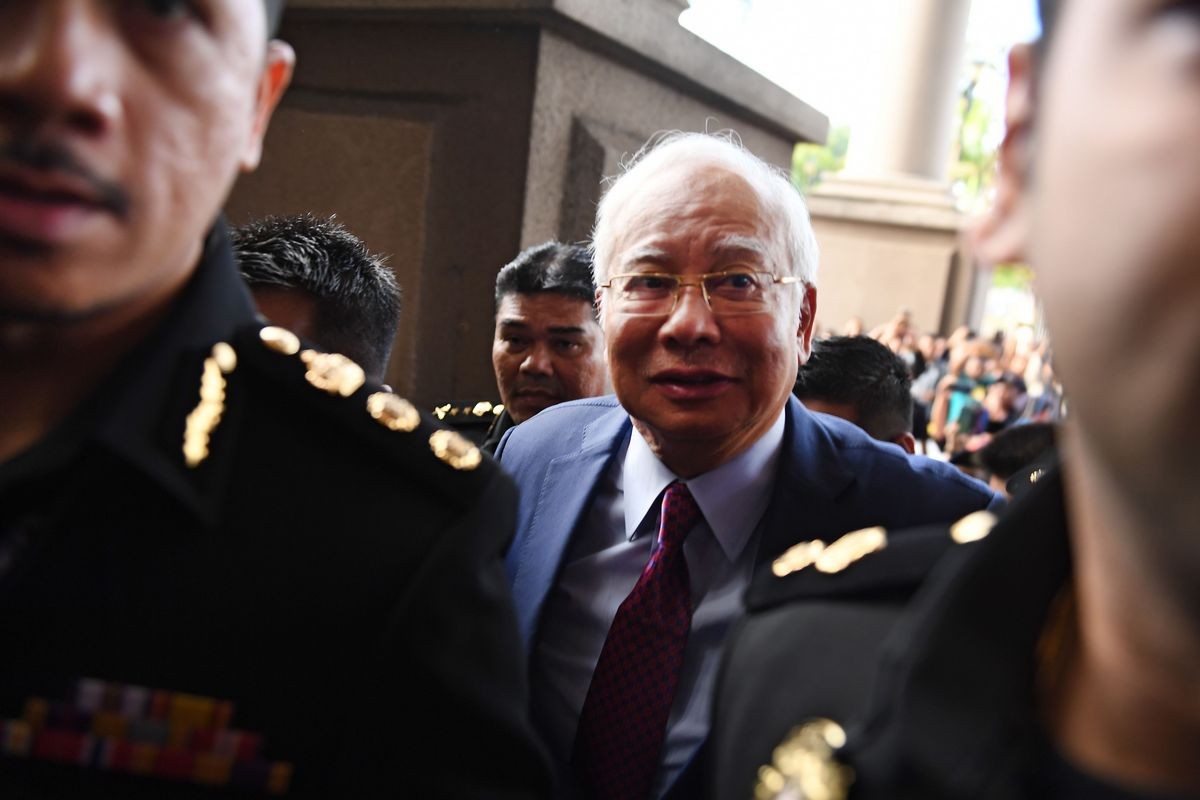 Former Malaysian PM pleads not guilty to breach of trust, abuse of power
