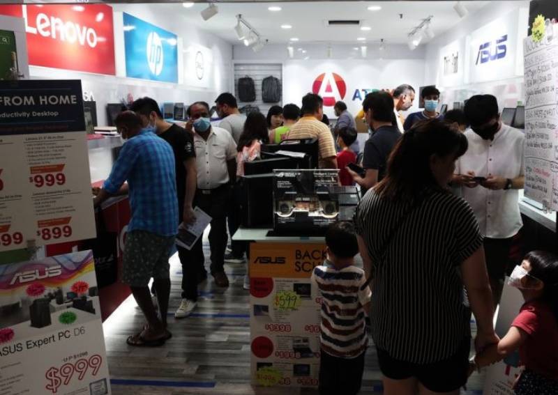Brisk sales of laptops, desks as people gear up to work at home