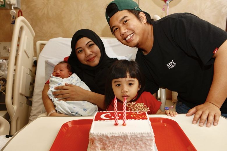 Couple welcome their second National Day baby at stroke of midnight