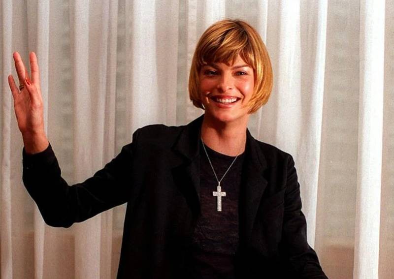'Brutally disfigured' Linda Evangelista poses for Vogue with face held by tape and elastic