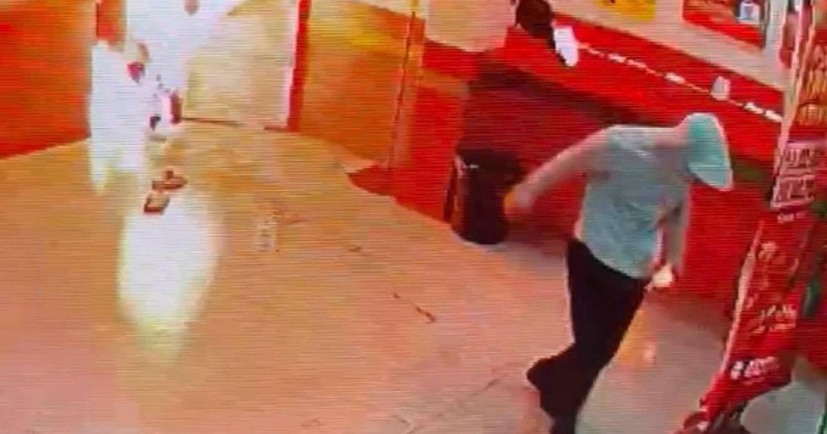 Woman set alight at Malaysian lottery outlet in 'act of shocking cruelty'