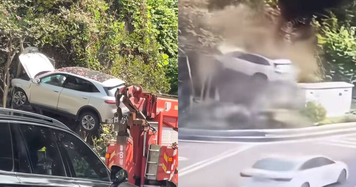 SUV dangles above slope after veering off road in Chongqing