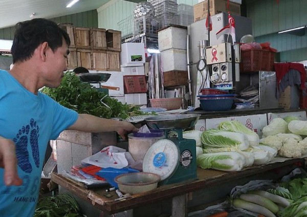 Woman arrested after about $3,000 stolen from vegetable stalls at Marine Terrace Market
