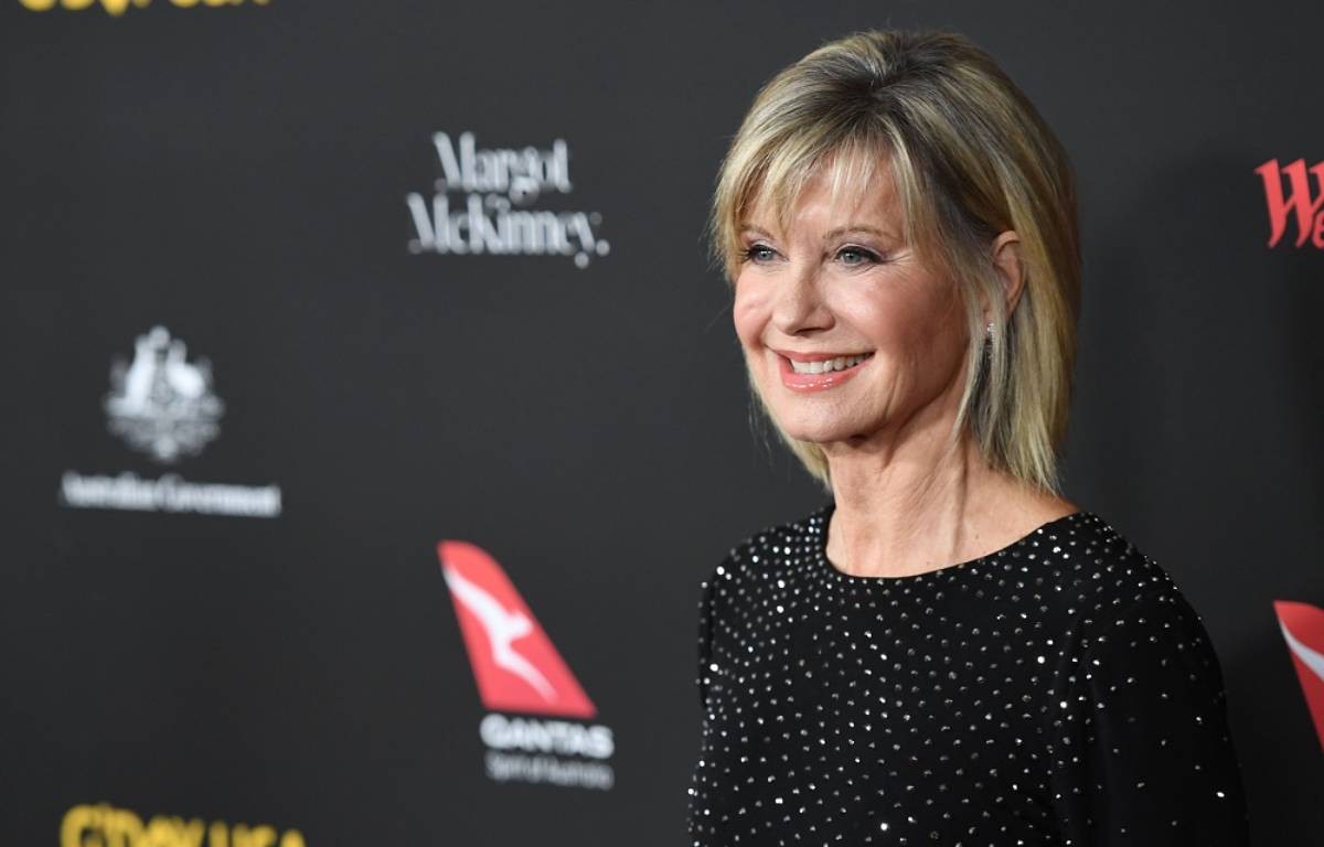 Olivia Newton-John has been gifted her Grease jacket after it was auctioned off for charity