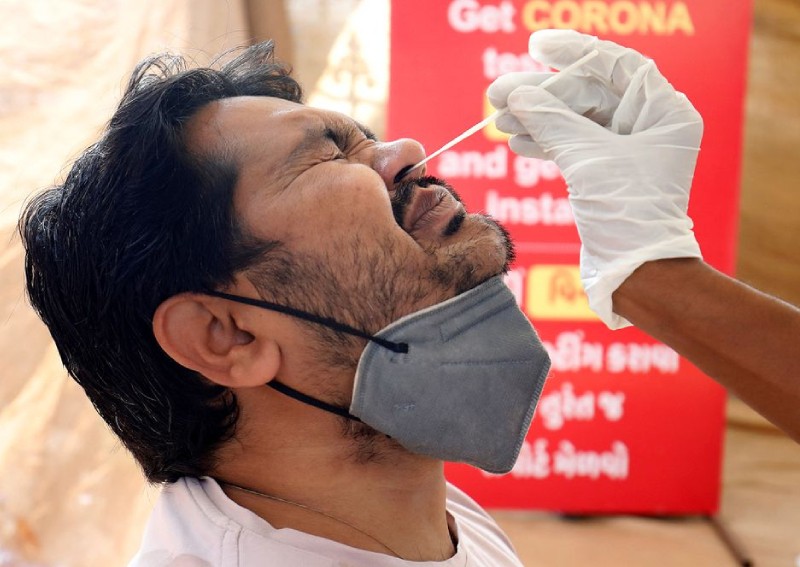 Masks come off, rallies begin as India's Covid-19 patient load falls