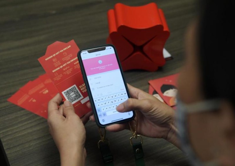 Give e-cash instead of physical red packets this Chinese New Year to support the environment, says MAS