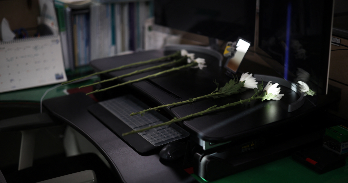 Empty desks and tears mark five colleagues killed in South Korean plane crash