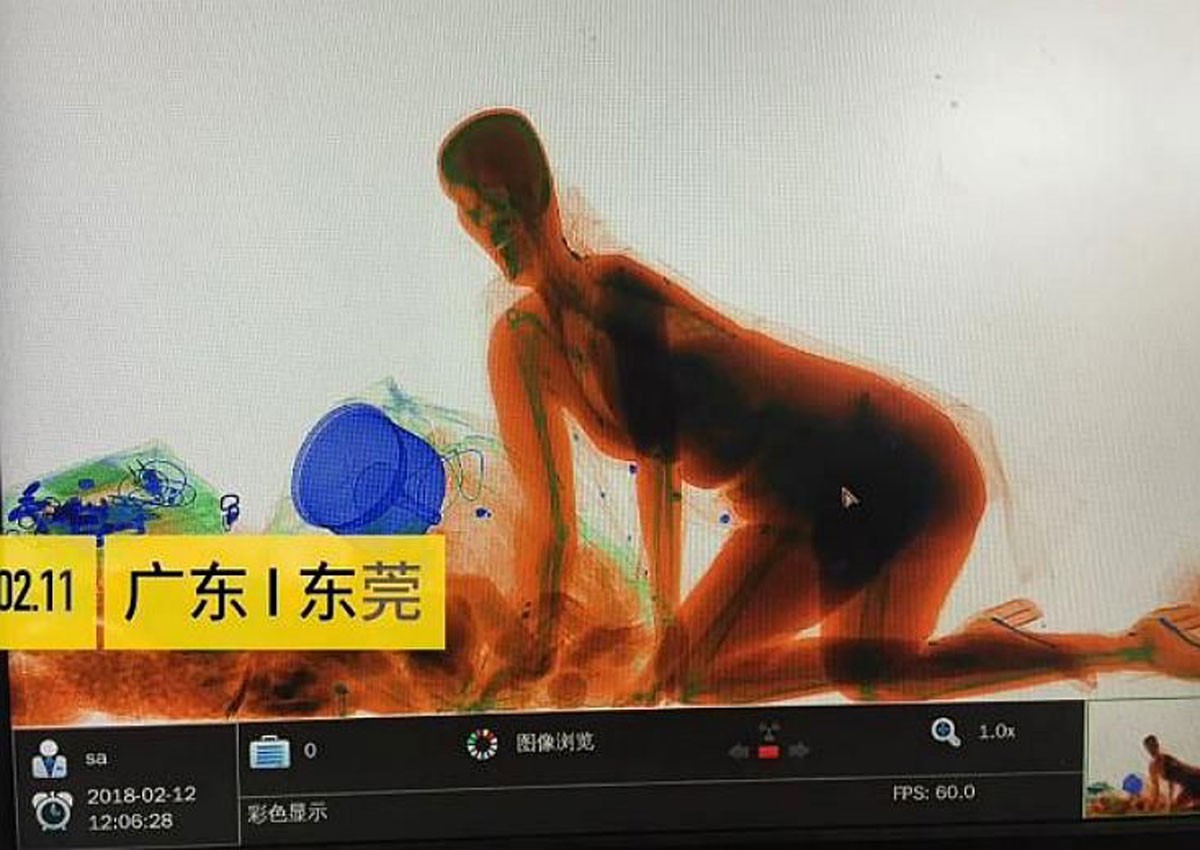 Cash and carry: Woman in China rides through X-ray scanner rather than part with purse 