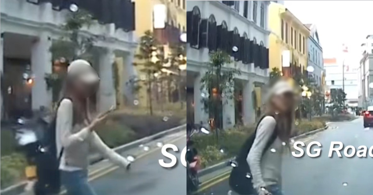 'Phone more important than life': Woman nearly gets hit by car while crossing road, draws flak from netizens