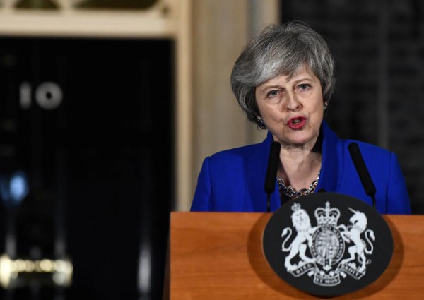 UK PM May reaches out to rivals after winning confidence vote