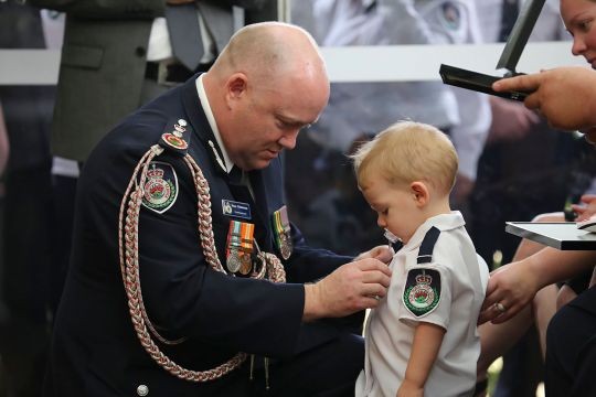Toddler son receives posthumous medal for killed Australian firefighter