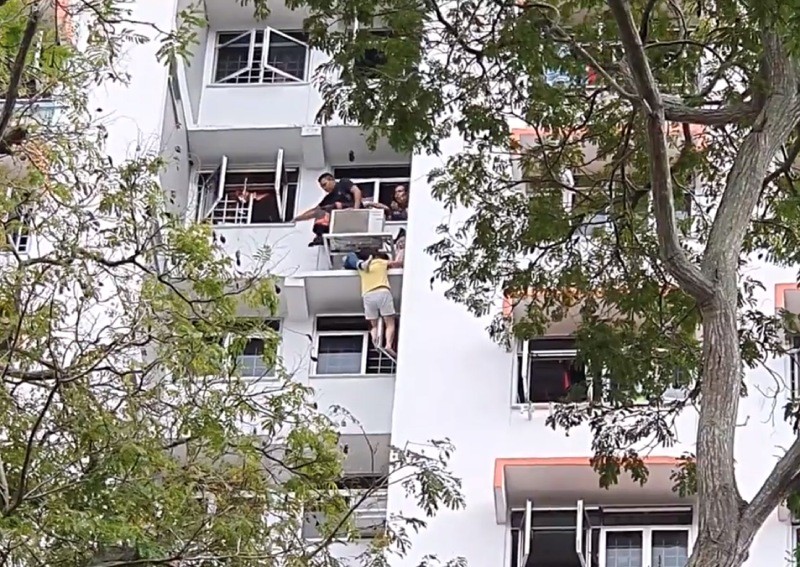 SCDF rescues woman hanging off air-con ledge at King George's Avenue