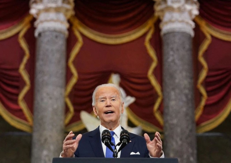 A year after US Capitol siege, Biden blasts Trump's 'web of lies'
