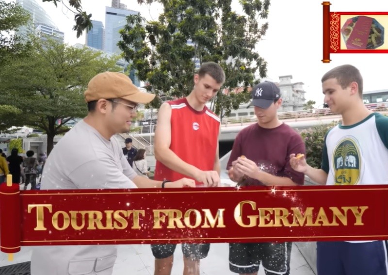 'Your face is getting red': Ghib Ojisan eggs tourists on to try 'bizarre' CNY goodies for the first time