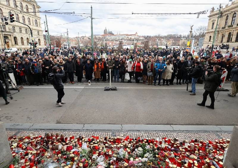 Mourners march, hold mass hug to remember Prague shooting victims