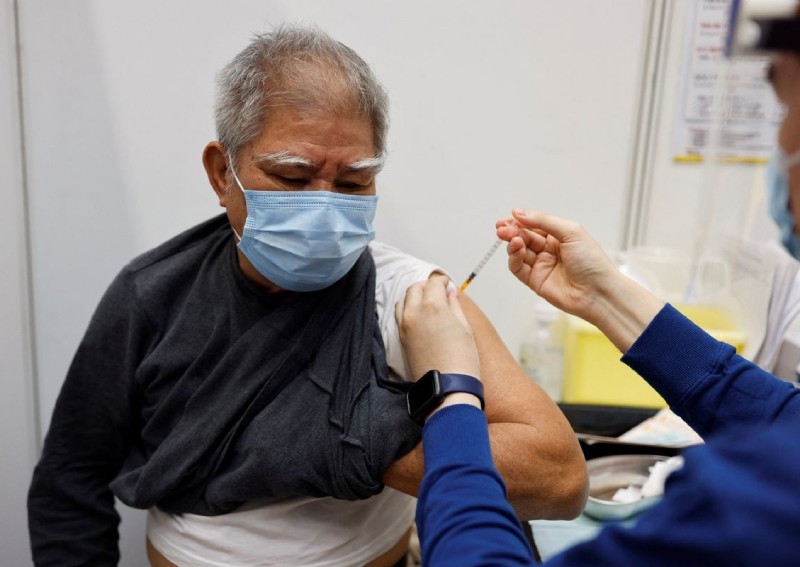 China says Covid-19 vaccines are safe as it reveals leaders have received shots