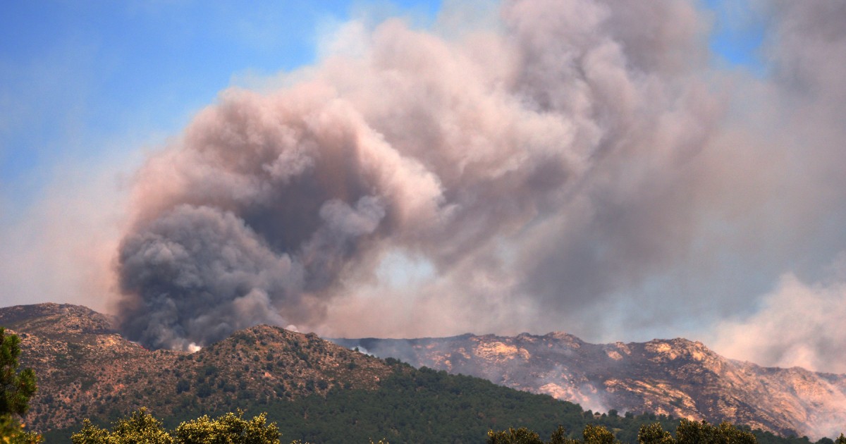 More than 200,000 people flee raging wildfires in France and Spain, some escaping by boat
