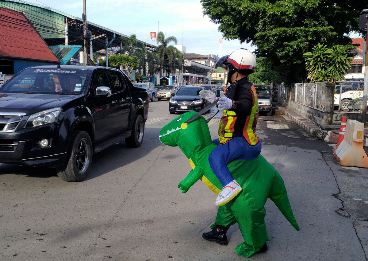 Doyouthinkhesaurus: Thai 'T-Rex' cop gives traffic safety lessons