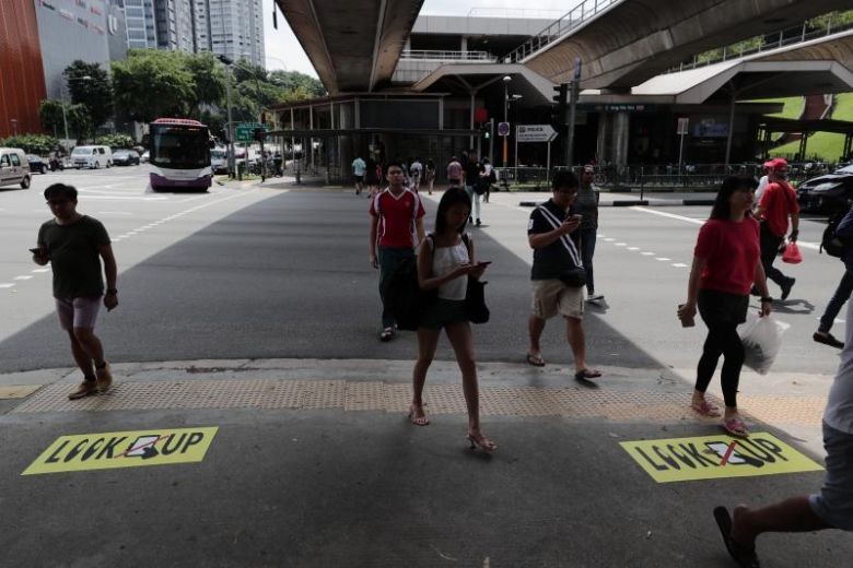 'Look up': Ang Mo Kio tackles distracted phone zombies at road junction with new signs