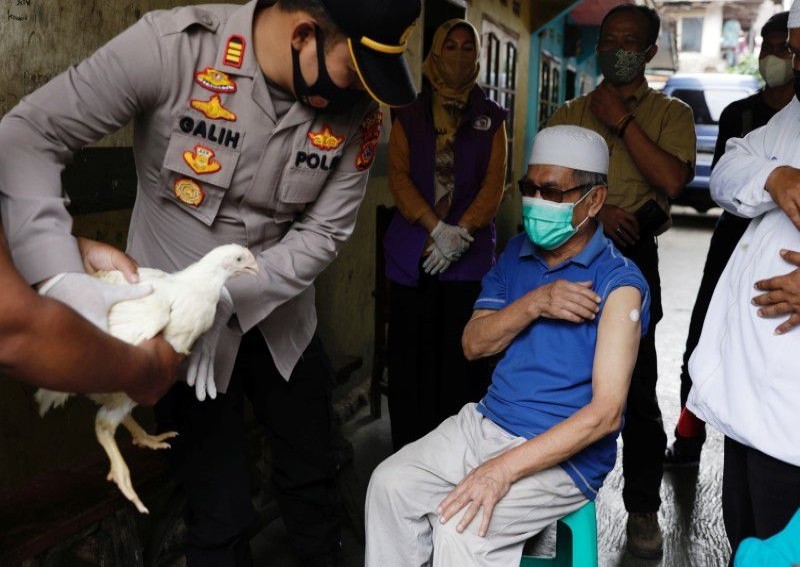 Chickens, cows, apartments offered up in Asia's vaccination lucky draws