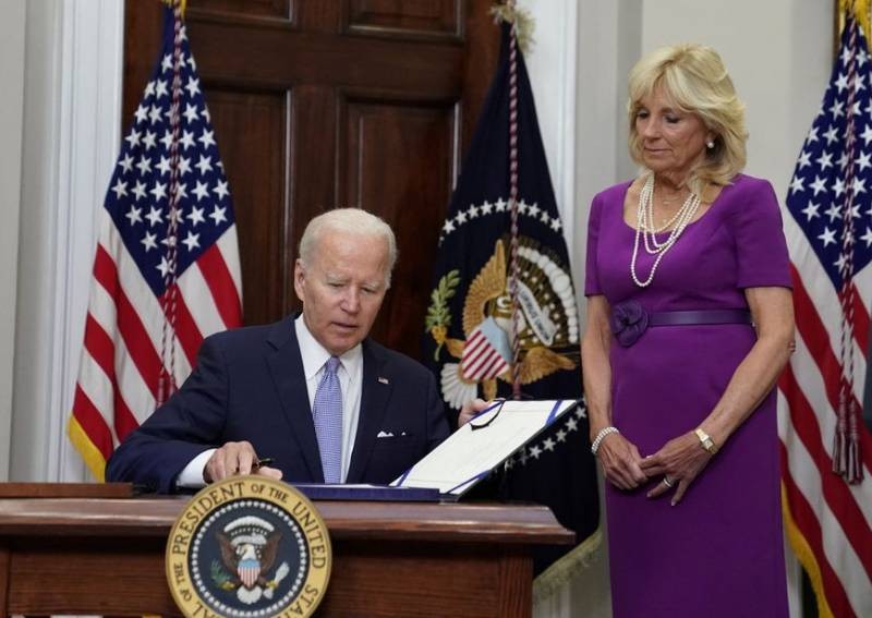 Biden signs gun safety bill into law, takes swipe at Supreme Court