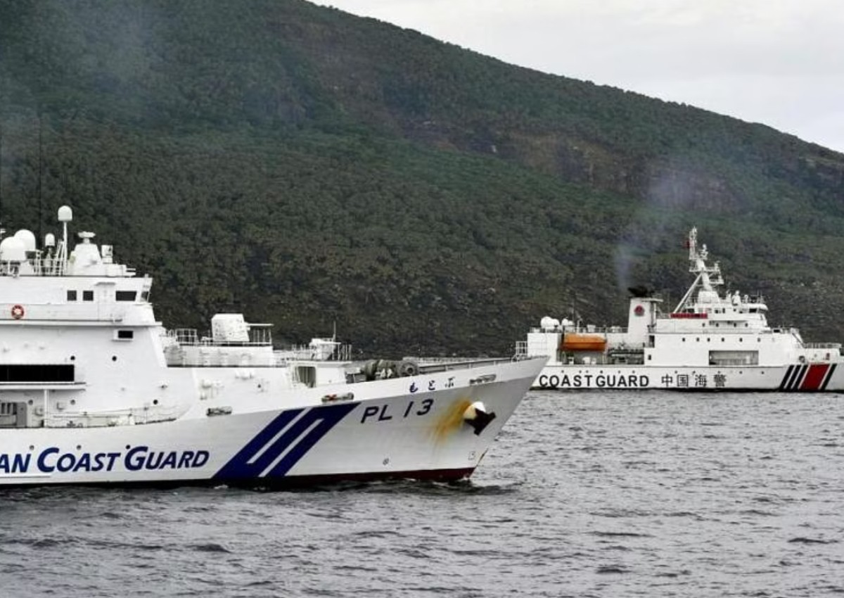 Chinese armed vessels patrol waters around disputed islands, angering Japan