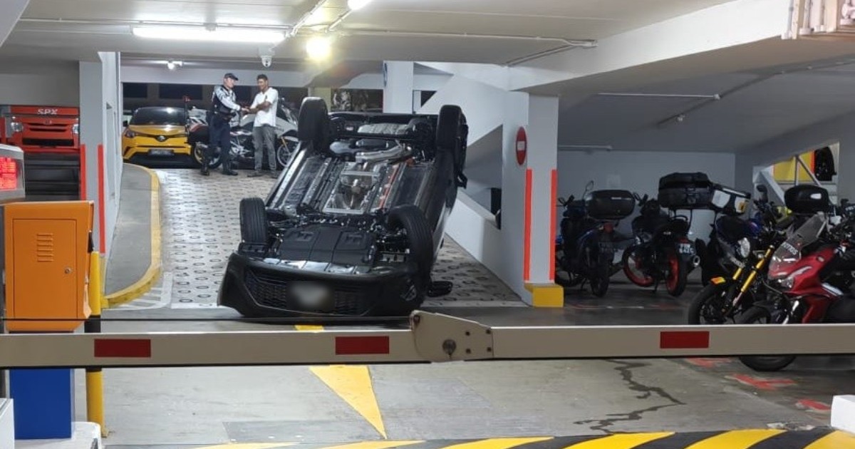 Car flips over in Woodlands car park, woman injured but declines trip to hospital
