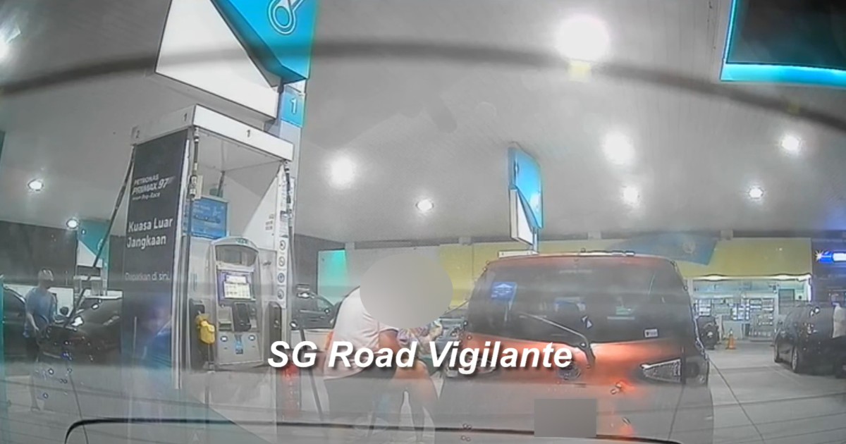 Baby in car? Man seen rocking Singapore-registered car while pumping petrol in Malaysia