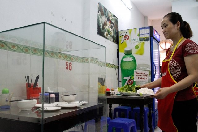 Vietnam restaurant owner encased bun cha table 'to preserve the memory of Mr Obama'
