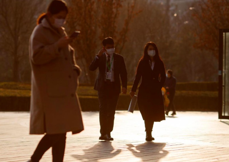 Some in Wuhan told to go back to work as new coronavirus cases subside in China