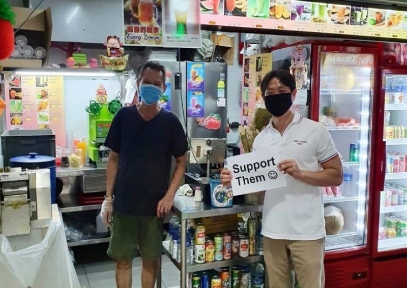 MP Louis Ng under police investigation for not getting permit before holding placard supporting hawkers