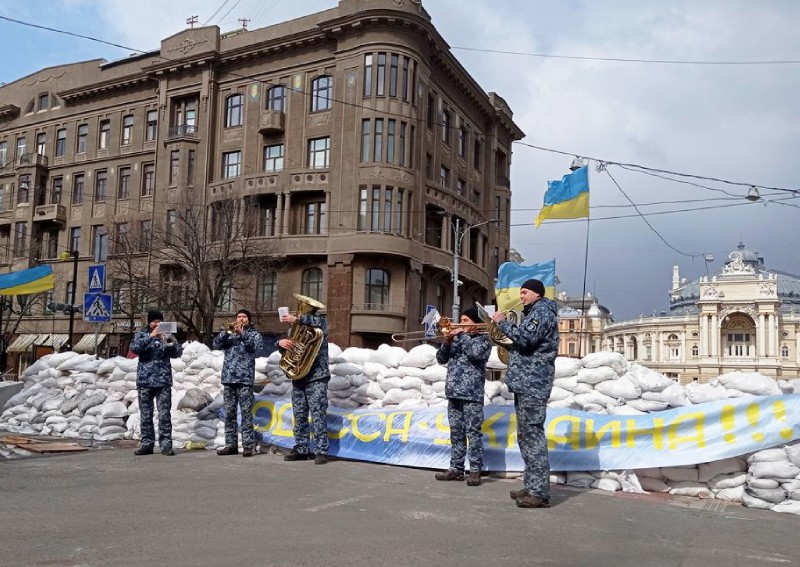 'Don't Worry, Be Happy': Behind sandbags, Odessa waits to see if it's next