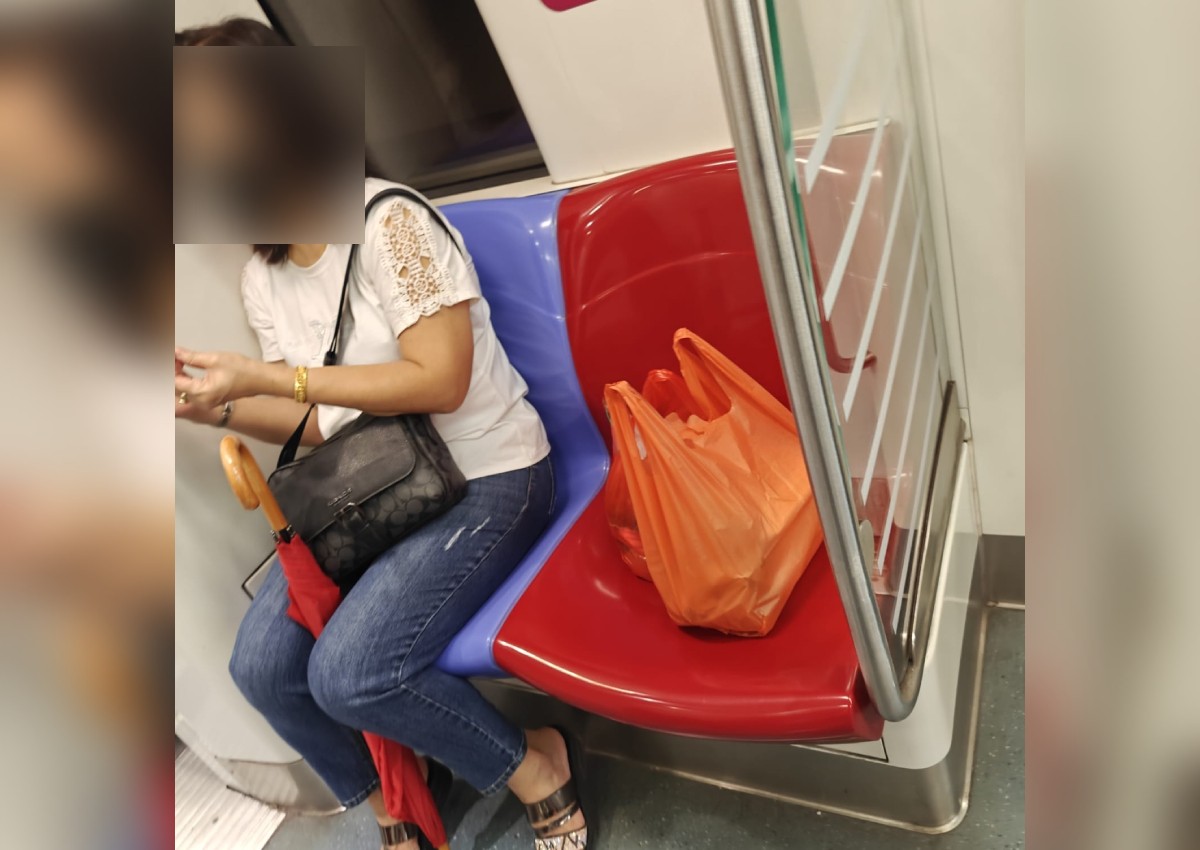'Go find other places to sit': Woman hogs MRT train priority seat with bags, 'swipes' away passenger with joint issues