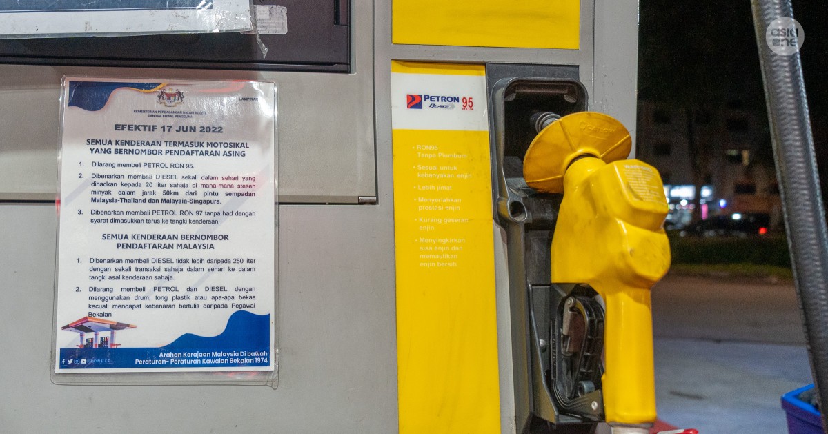 2 Malaysians banned from Ron95 petrol subsidy following viral video of woman filling container in car boot