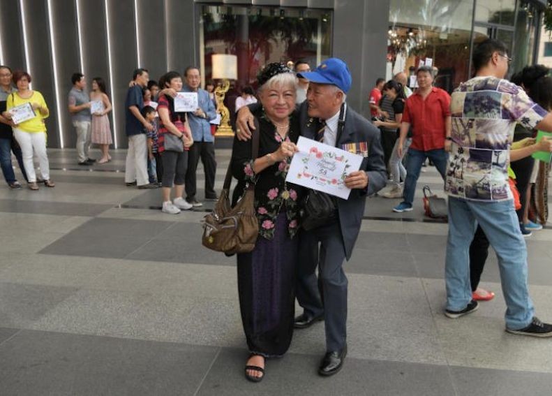 Couples 'freeze' on Orchard Road for World Marriage Day