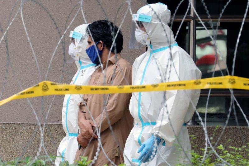 Malaysia rounding up migrants to contain coronavirus spread, police say