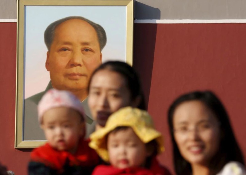China to relax birth policy but wary of social risks, sources say