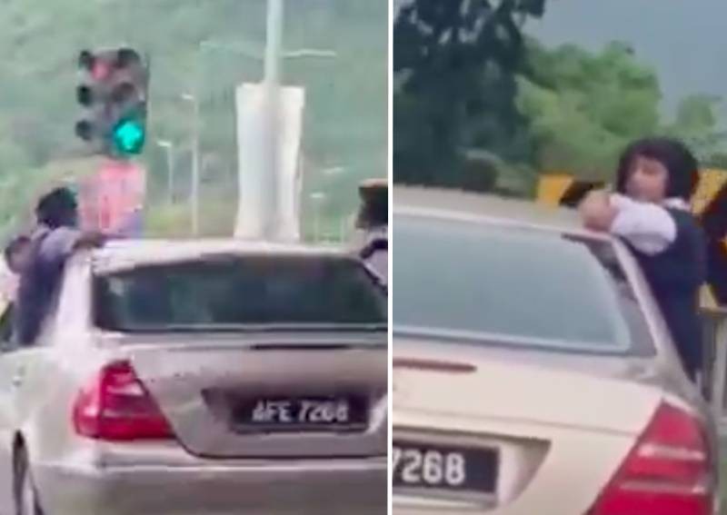 Kids sticking bodies out of moving car: Perak dad pleads not guilty to child endangerment
