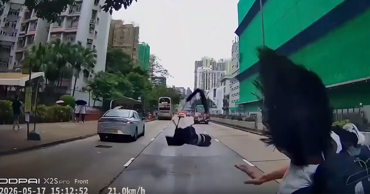 HK teen dashes across road to photograph idol on bus wrap, hit by car and sent flying 
