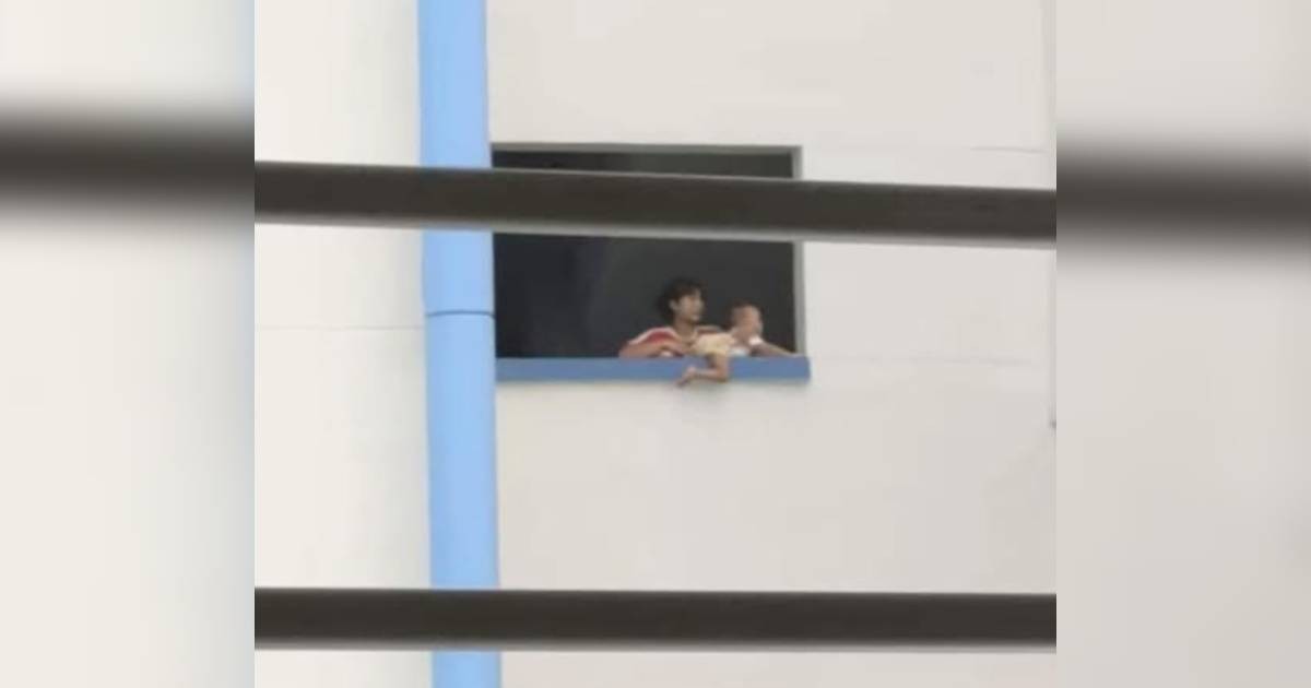 Police investigating after woman caught placing baby on HDB ledge