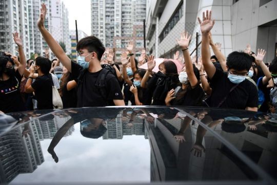 China says Hong Kong courts have no power to rule on face mask ban