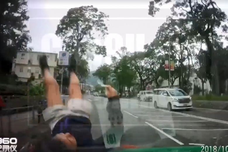 Watch: Teenager hit by taxi in Hong Kong picks herself up calmly after accident