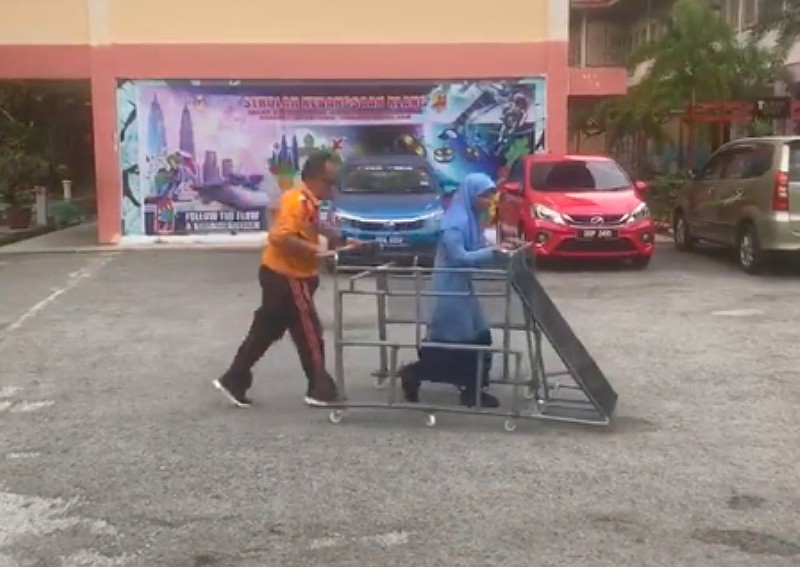 Malaysian PE teacher builds assistive frame, allowing visually-impaired students to run freely in viral video